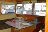 Inviting Dining Table and Seats in Classic 1962 Shasta Trailer